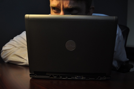This is an image of man using a laptop.